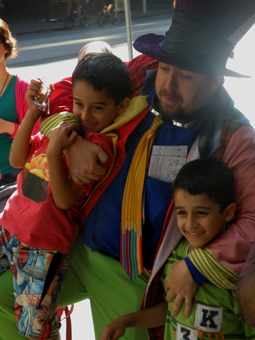 Matty Hatter wrestling some boys at the request of their parents at the 2013 MICF